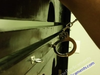 Gay Bondage Sub Cuffed Balls to Wall